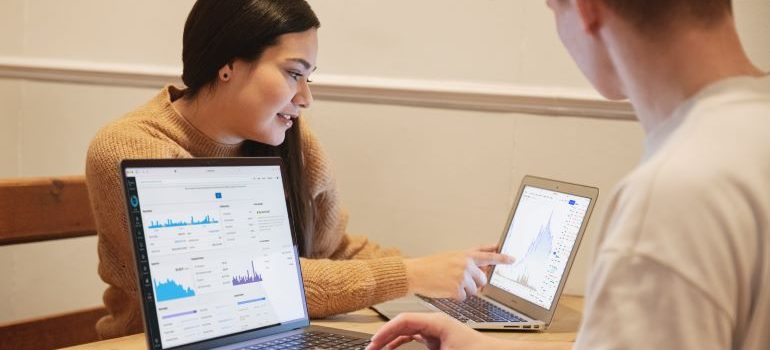 two people preparing the budget for moving your business from North Bergen to Bayonne